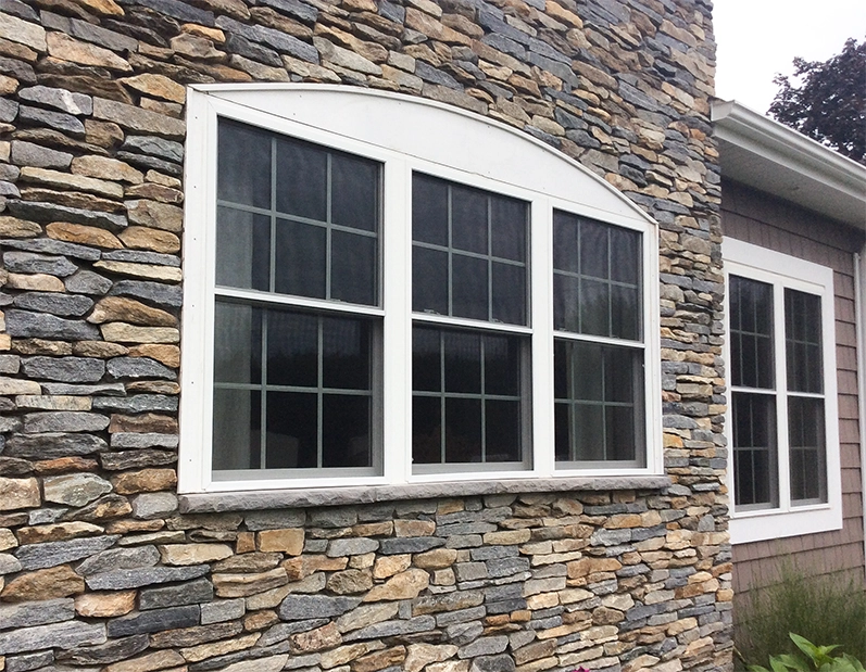 Double hung window replacement with stone siding on a house in CT